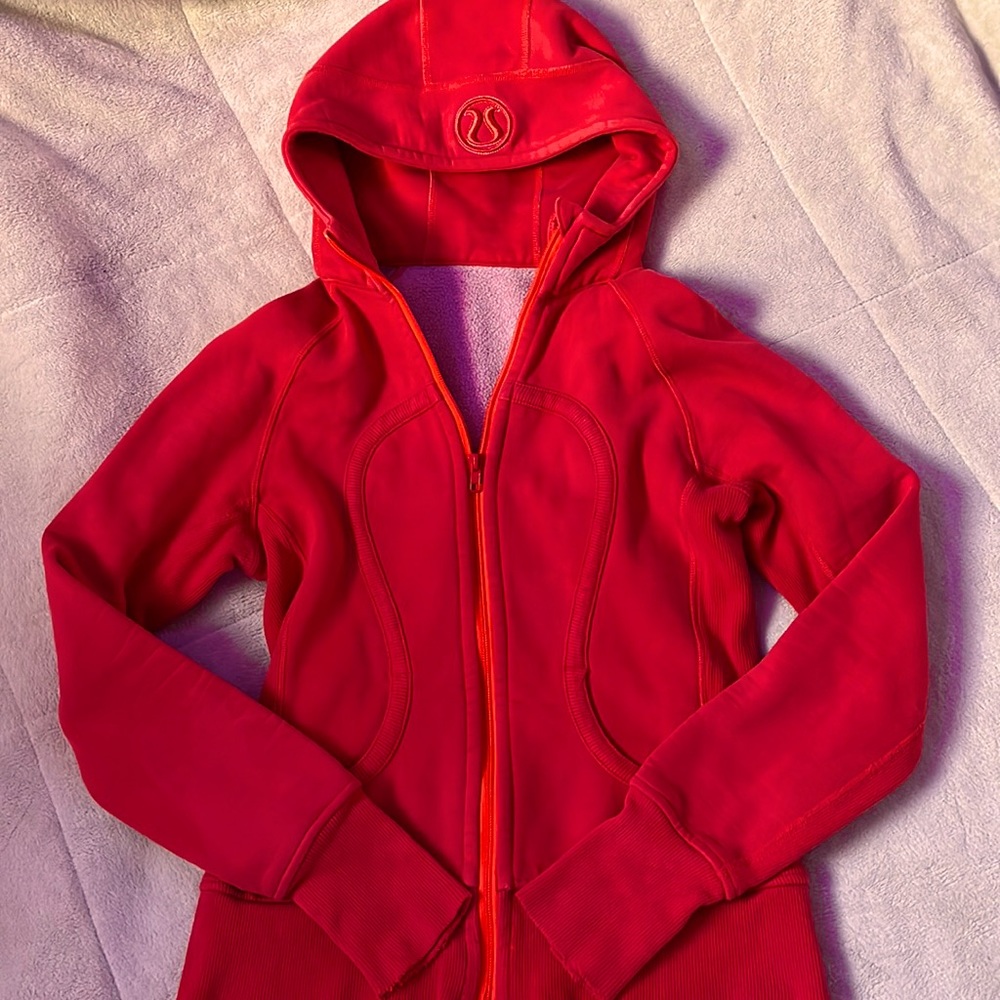 Lululemon Scuba/orangish red/never worn once/not sure of the size but XS or S